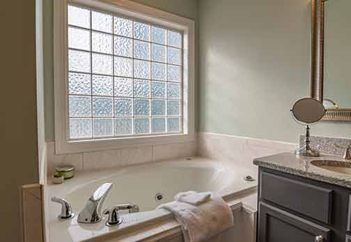 A tub in a modern bathroom is kept clean with drain cleaning practices.