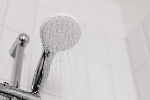 Water coming out of a shower head.
