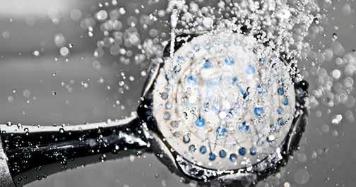 Water pouring from a shower head.