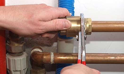 a plumber upgrading and repiping a customers home in chicago.