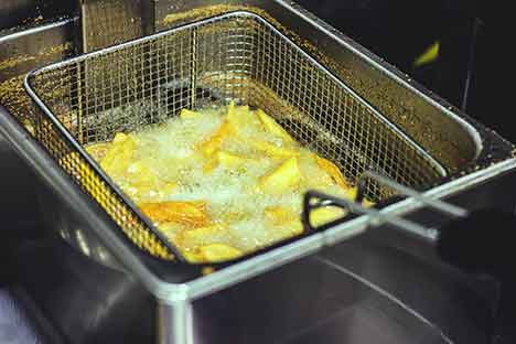 french fries inside the fryer