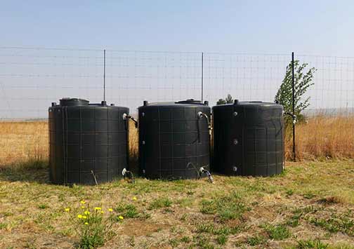 Outdoor Water Storage Tanks in an Arid Landscape
