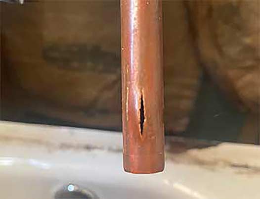 a burst pipe in need of repair.