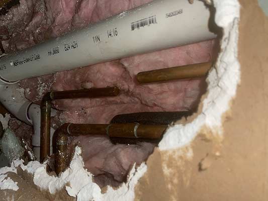 a located burst water pipe in a home.