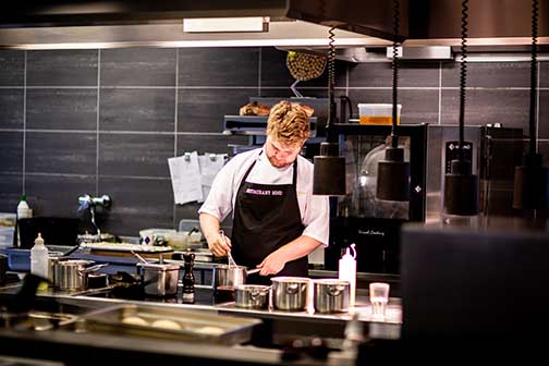 a chef in a commercial kitchen.