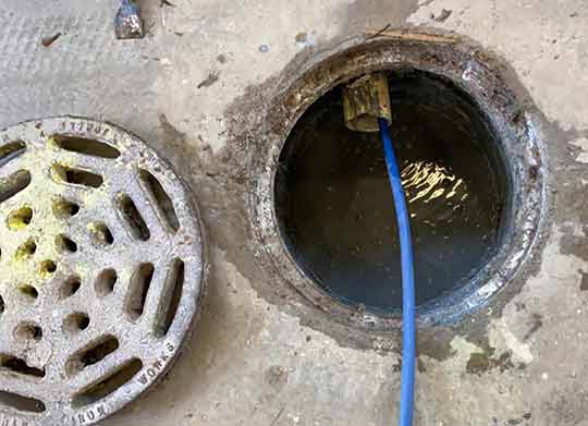 a commercial hydro jetting to help clean business drains.