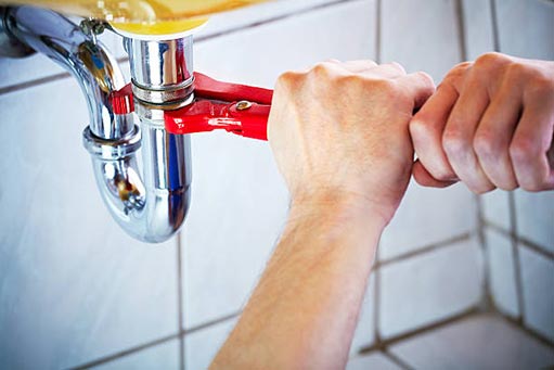 a man attempting diy plumbing.