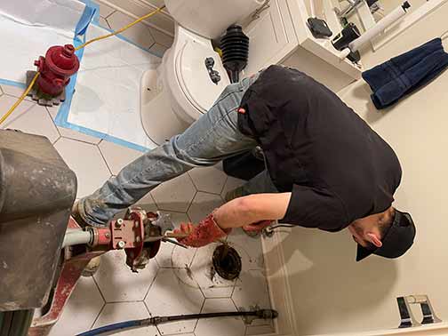emergency drain cleaning services in chicago being performed.