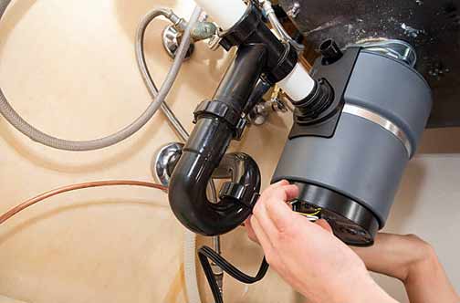 how to fix a jammed garbage disposal