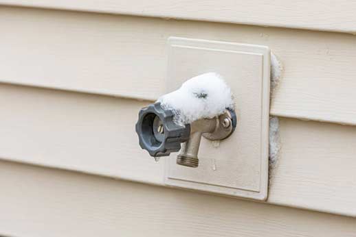 a frozen outdoor faucet.