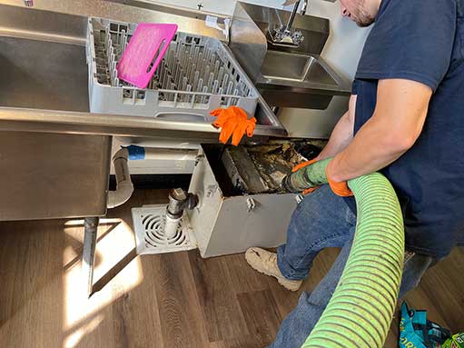 Grease Trap Cleaning Service in Chicago a grease trap cleaning in a chicago restaurant.