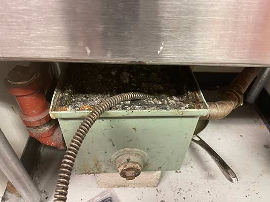 a grease trap that needs to be unclogged.