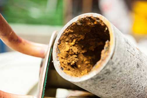 hard water drain buildup in pipe