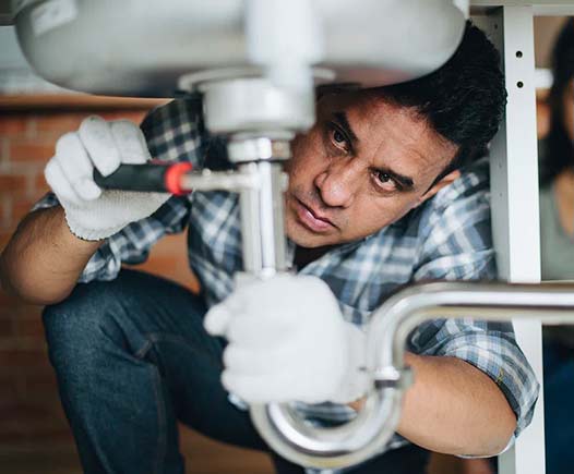 an unlicensed plumber attempting to make a repair.