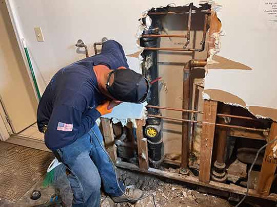 a home in chicago being repiped by a plumber.