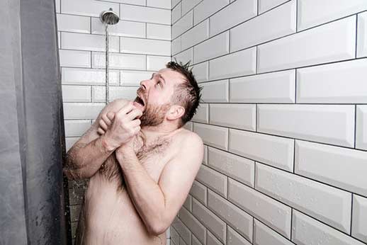 a man experiencing a hot water shortage.