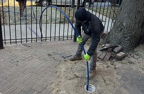 a plumber hydro jetting a sewer line in bucktown chicago