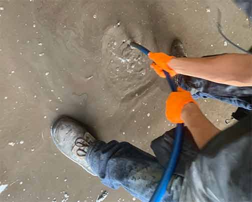 a hydro jetting drain cleaning being performed.