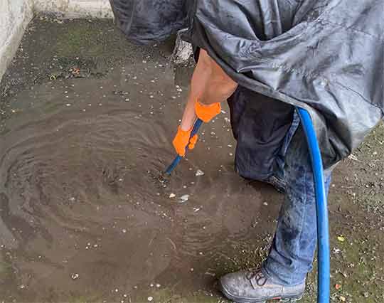 plumber maintaining drainage systems with a hydro jetting service.