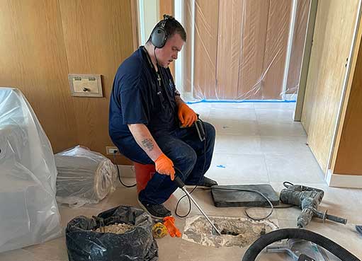 a plumber performing leak detection services.