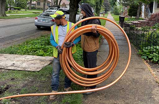 plumbers performing a main water line replacement in chicago.