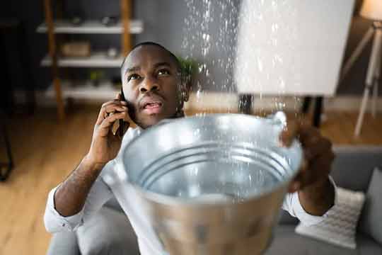 a man going through a plumbing emergency.