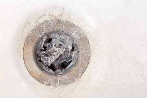 professional drain cleaning services on a drain.