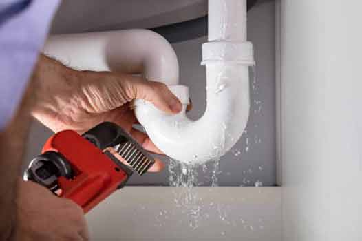 a professional plumber repairing plumbing.