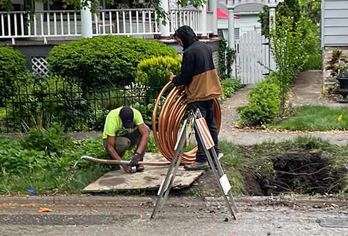 plumbers replacing water service lines.