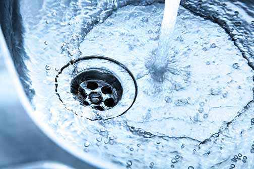 running water helps the smell of a garbage disposal.