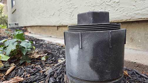 a sewer clean out on the side of a house